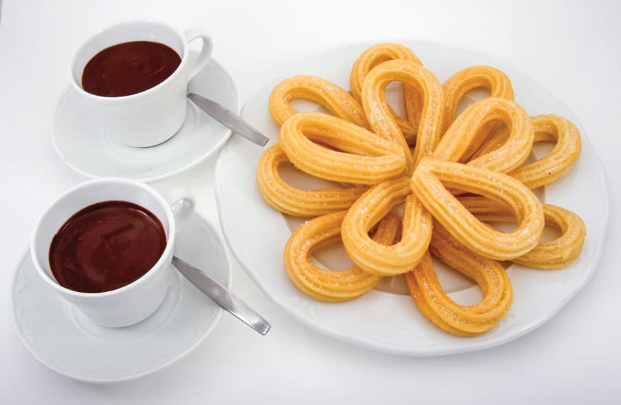 Hiszpanski pejzaz w garnku Churros